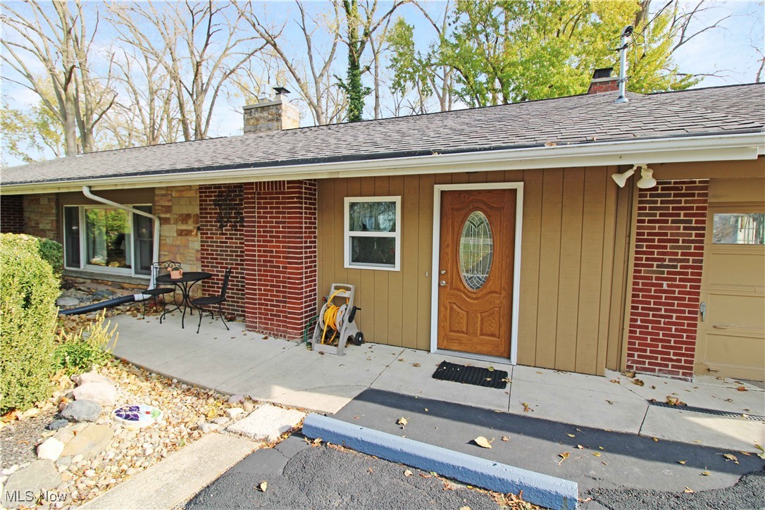 2708 East Sand Road Port Clinton, OH 43452 - Photo 2 of 33 View of exterior entry featuring a garage