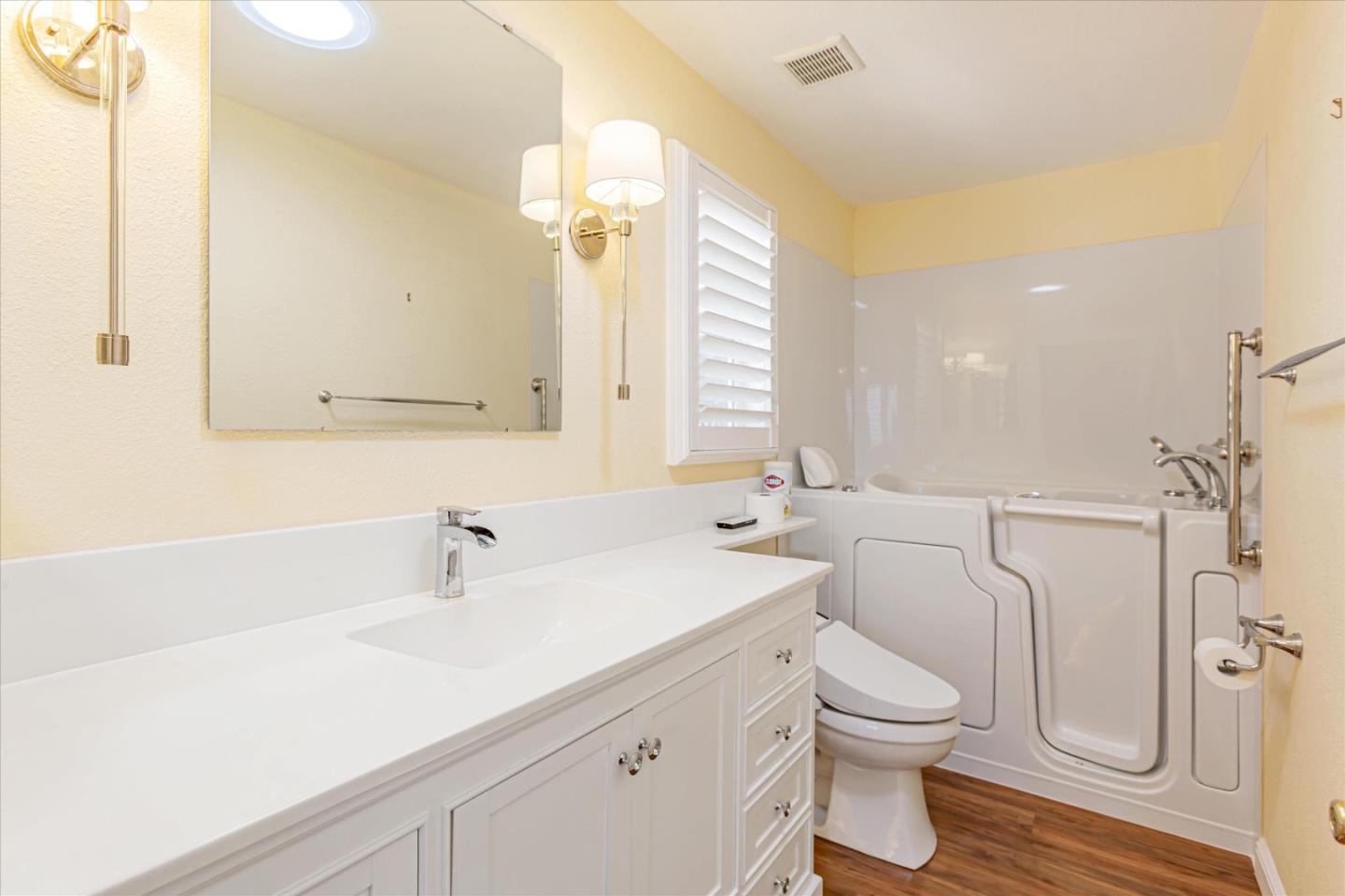 53 Galloway Drive, Unit 53 Concord, CA 94518 - Photo 13 of 24 a bathroom with a sink a toilet and a large mirror