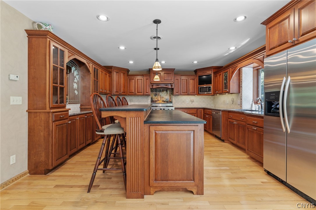 1103 Rail Fence Road Camillus, NY 13031 - Photo 17 of 50 Custom cherry kitchen with granite countertops and soapstone island. This kitchen is a chefs dream