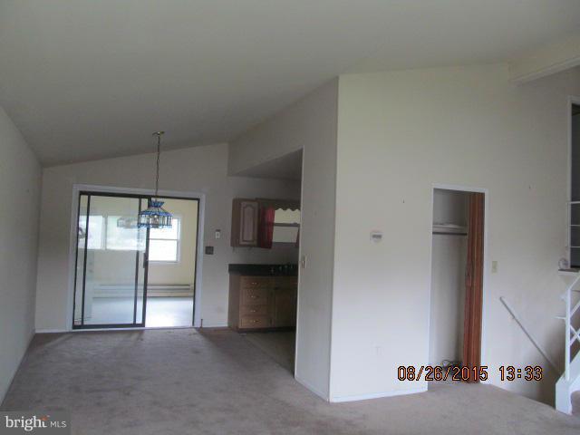 109 South Bend Road Glen Burnie, MD 21060 - Photo 2 of 21 an empty room with windows and entrance