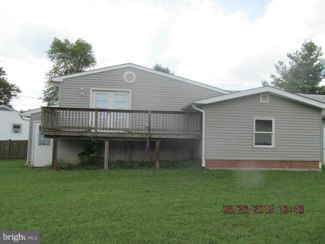 109 South Bend Road Glen Burnie, MD 21060 - Photo 16 of 21 a front view of a house with a garden and deck
