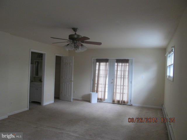 109 South Bend Road Glen Burnie, MD 21060 - Photo 7 of 21 an empty room with a fan & a window