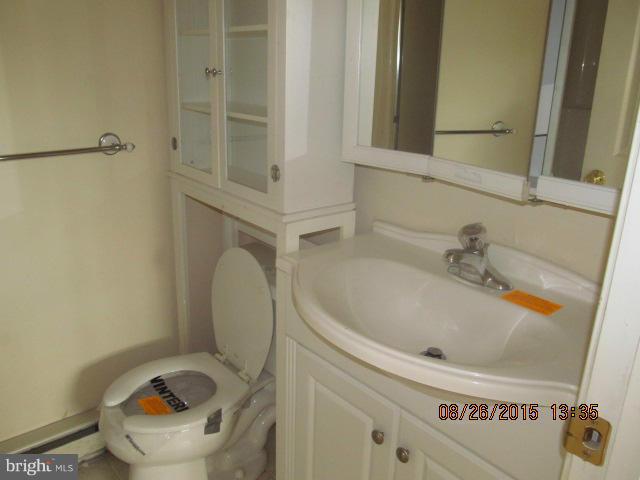 109 South Bend Road Glen Burnie, MD 21060 - Photo 9 of 21 a bathroom with a sink and a toilet