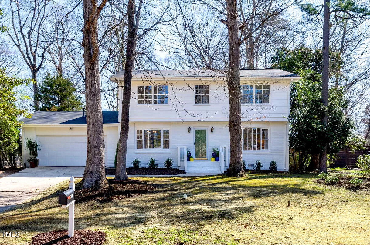 7416 Fiesta Way Raleigh, NC 27615 - Photo 1 of 27 a view of a house with snow on the tree