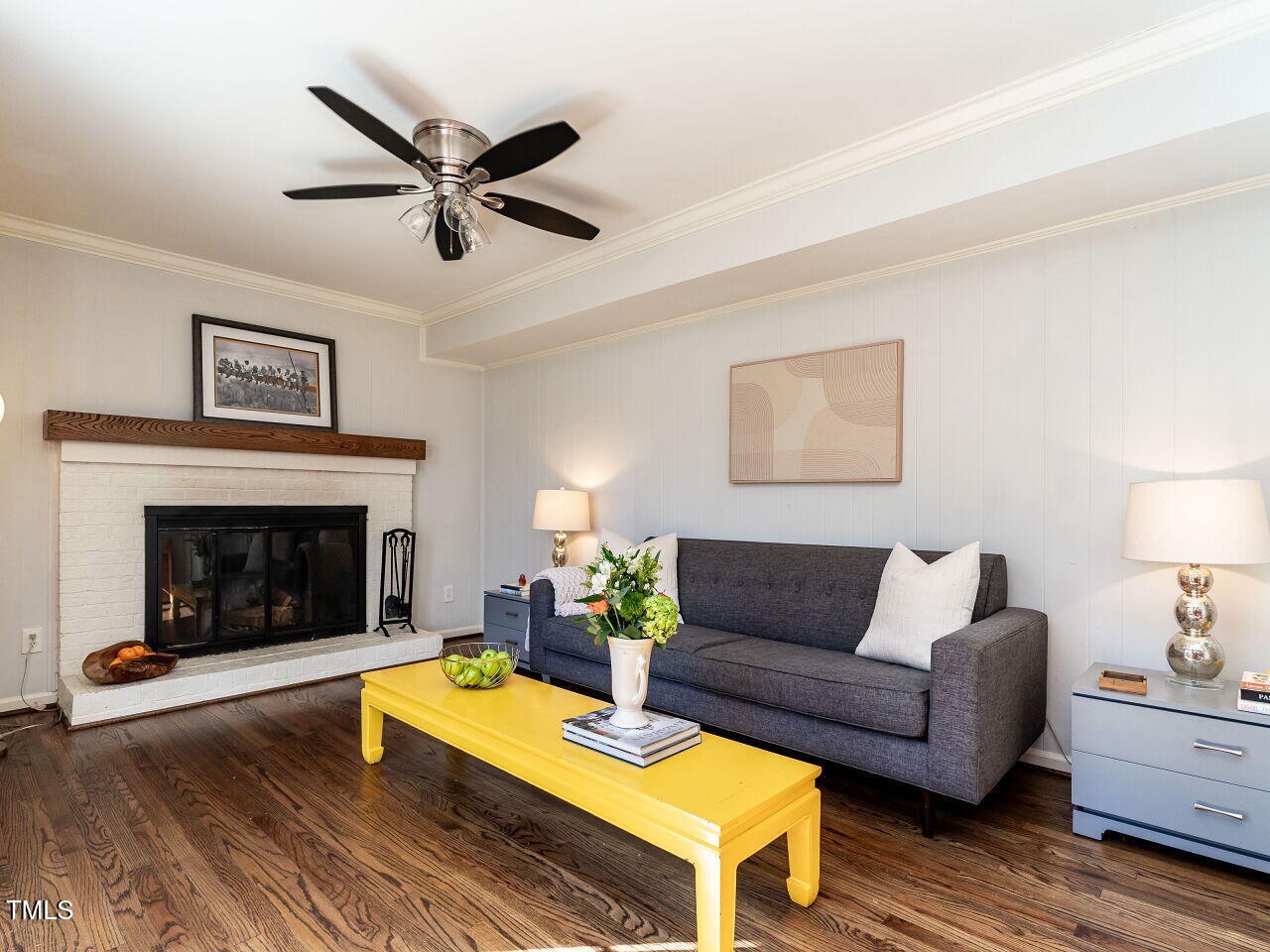 7416 Fiesta Way Raleigh, NC 27615 - Photo 14 of 27 a living room with furniture and a fireplace
