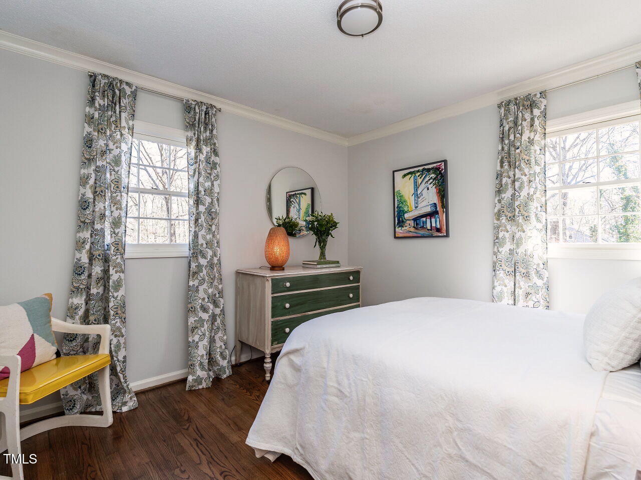 7416 Fiesta Way Raleigh, NC 27615 - Photo 15 of 27 a bedroom with a bed and a window