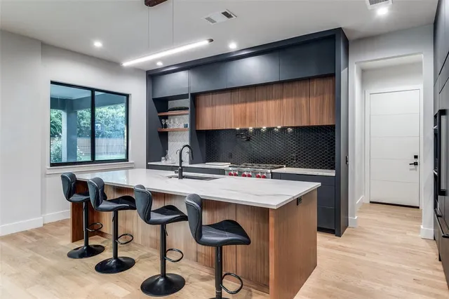 a kitchen with a table and chairs in it