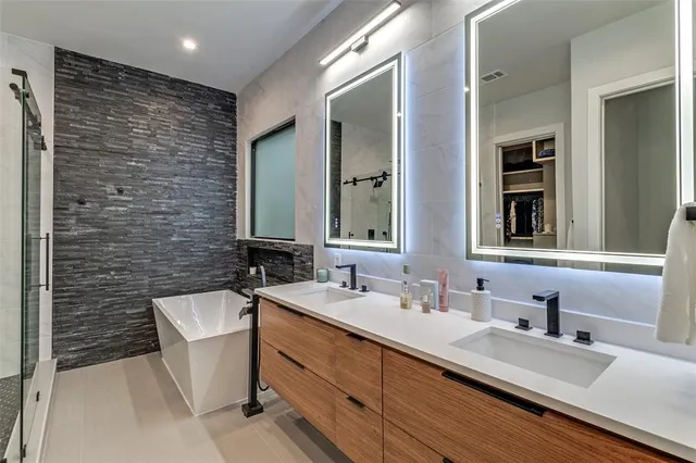 a bathroom with a double vanity sink and a mirror