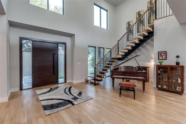 a living room with furniture and stairs
