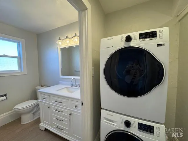 a bathroom with a sink and a washer dryer