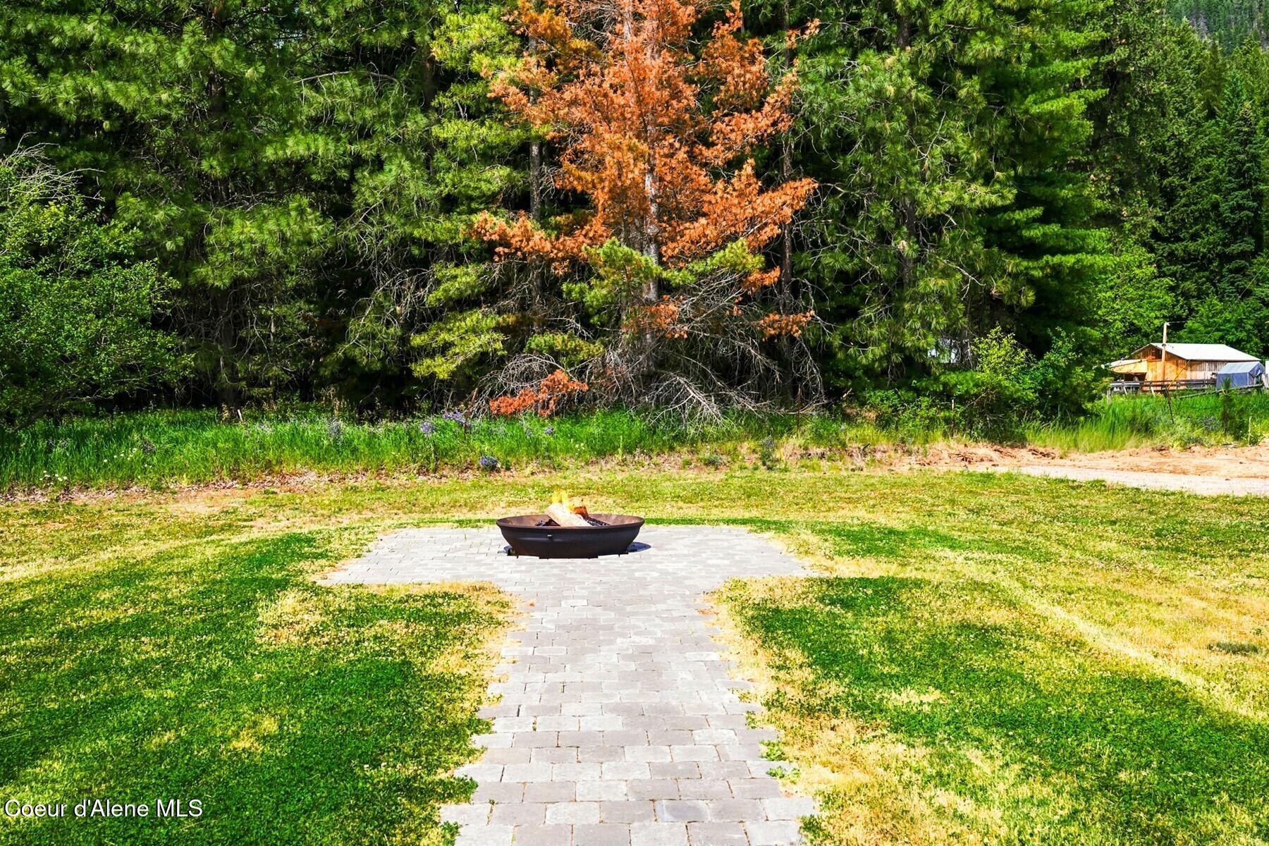 1317 Prominence Court Sandpoint, ID 83864 - Photo 37 of 44 Fire Pit and Paver Walkway