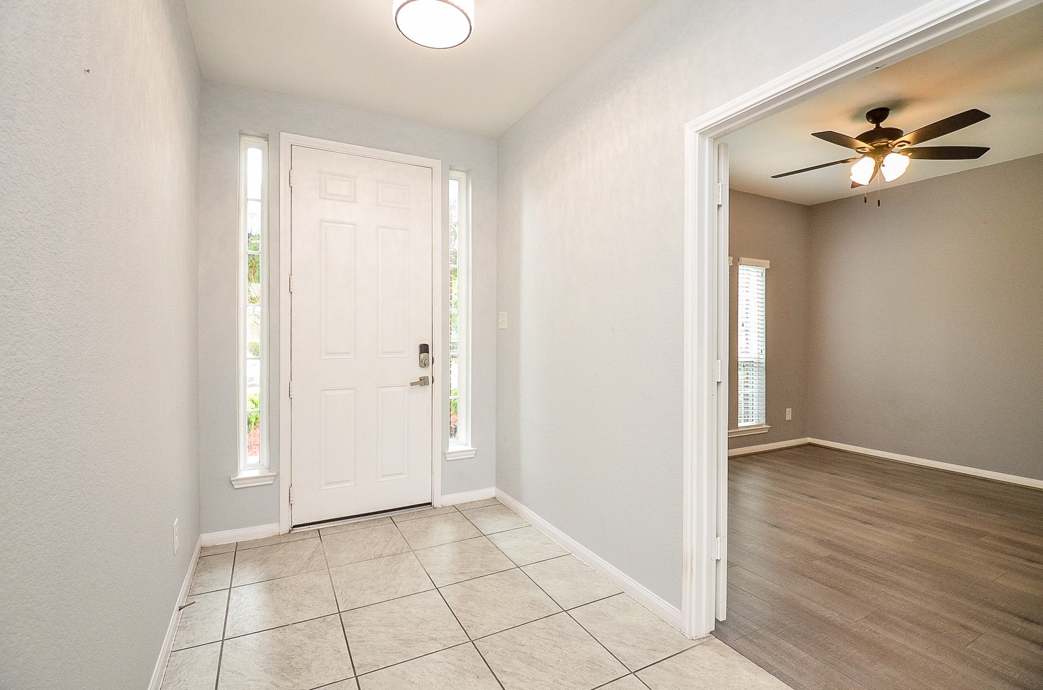 7042 Sliding Rock Circle Spring, TX 77379 - Photo 3 of 36 Elegant entryway leading to a versatile office/study, perfect for productivity or relaxation.