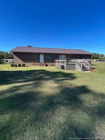 a view of a house with a big yard