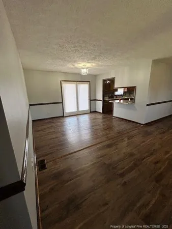 a view of a hardwood floor in hallway