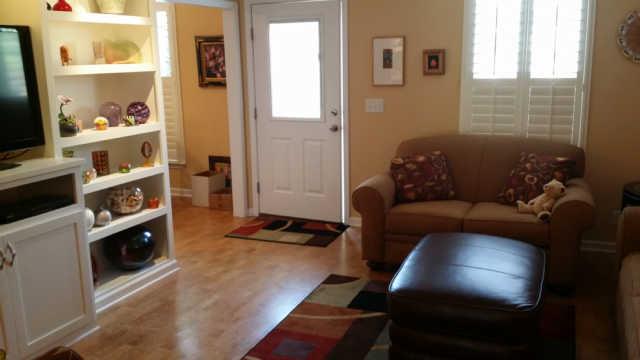 1034 General George Patton Road, Unit 1034 Nashville, TN 37221 - Photo 5 of 20 With built in shelves, this den is perfect for family time, TV or just relaxing with a good book.