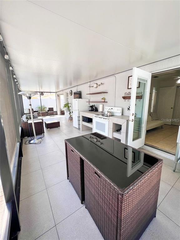 307 Diamond Ridge Boulevard Auburndale, FL 33823 - Photo 23 of 31 a living room with furniture and a flat screen tv