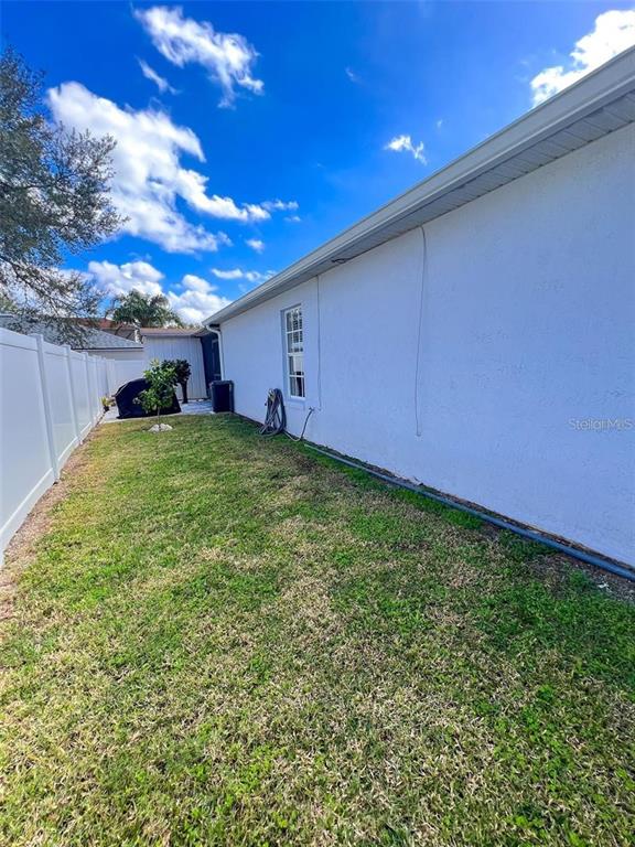 307 Diamond Ridge Boulevard Auburndale, FL 33823 - Photo 28 of 31 a view of a backyard with garden