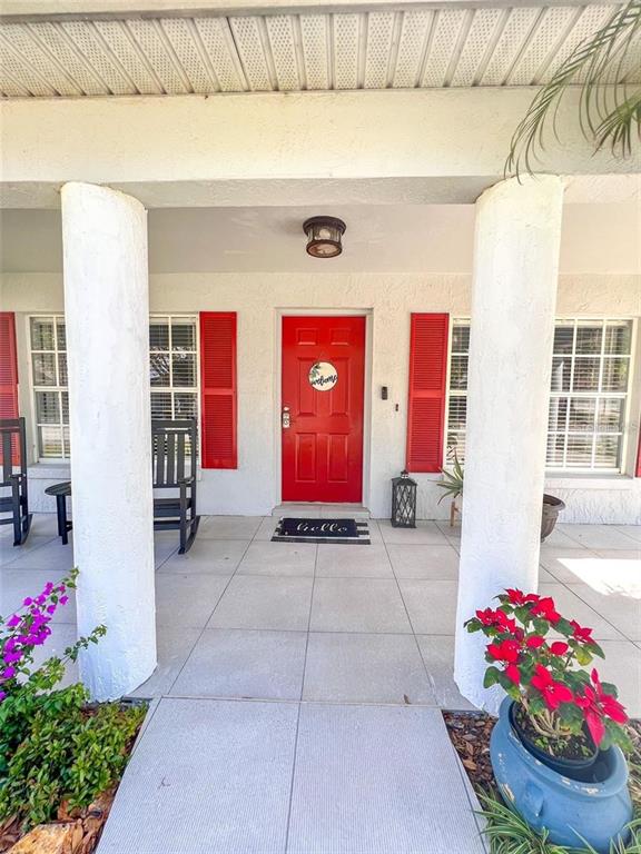 307 Diamond Ridge Boulevard Auburndale, FL 33823 - Photo 3 of 31 a view of front door of house and flowers