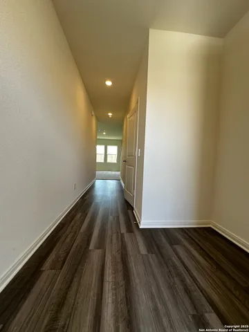 a view of wooden floor in an empty room