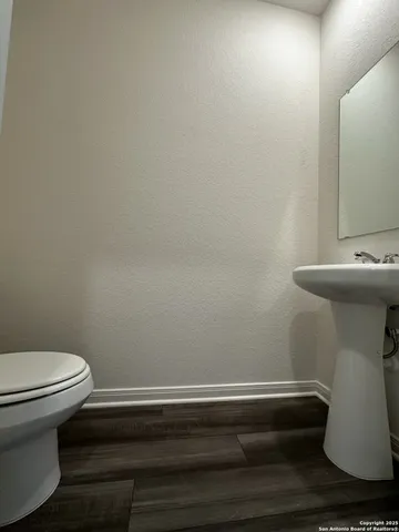 a bathroom with a toilet and a sink