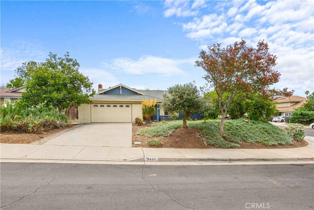 3430 Bahia Place Riverside, CA 92507 - Photo 3 of 34 a view of a house with a yard and garage