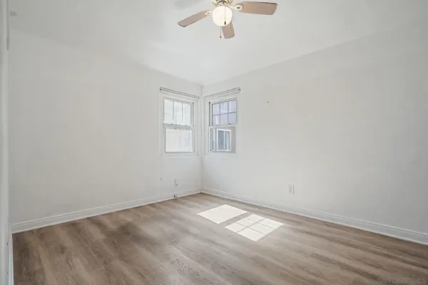 a bathroom with a bathtub and a window