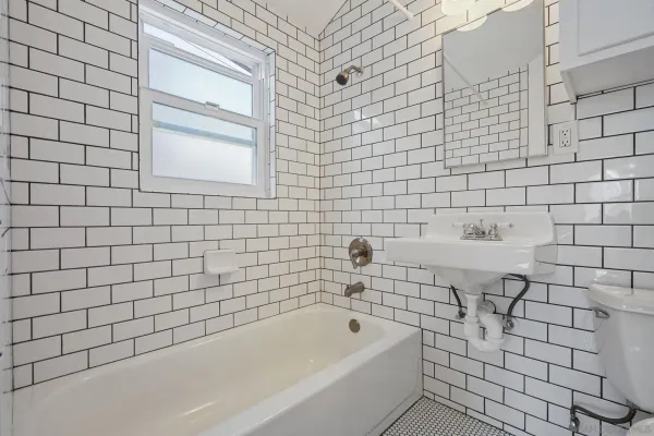 a view of a balcony with wooden floor and fence
