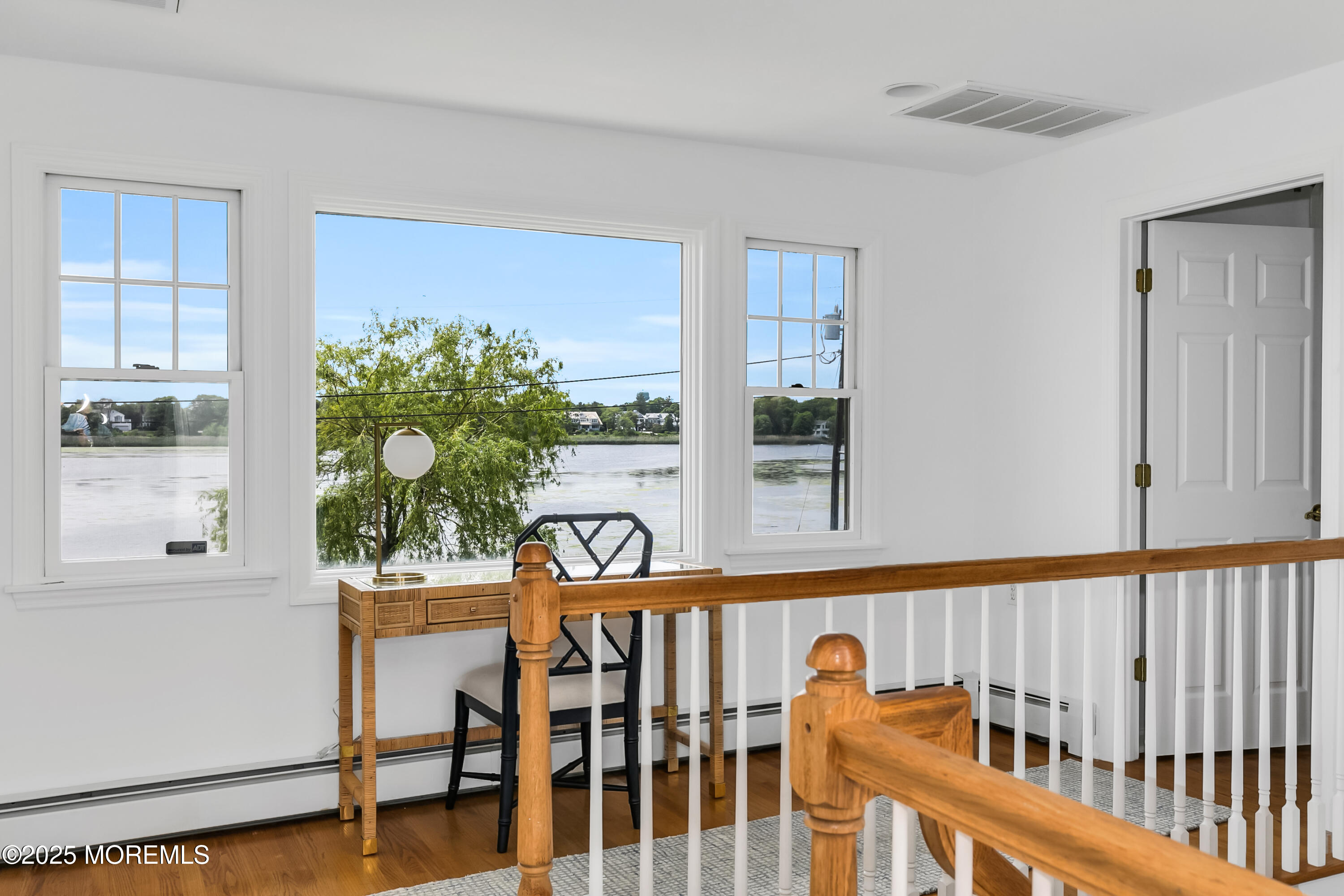 306 Ocean Road Spring Lake, NJ 07762 - Photo 24 of 58 a view of a porch with a table and chairs