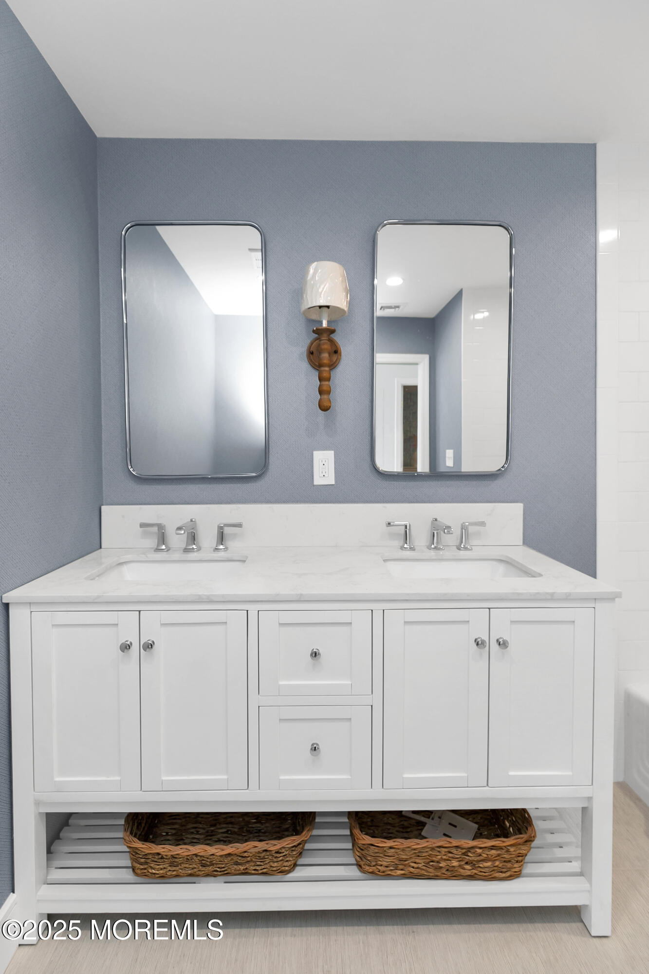 306 Ocean Road Spring Lake, NJ 07762 - Photo 30 of 58 a bathroom with a sink vanity and mirror