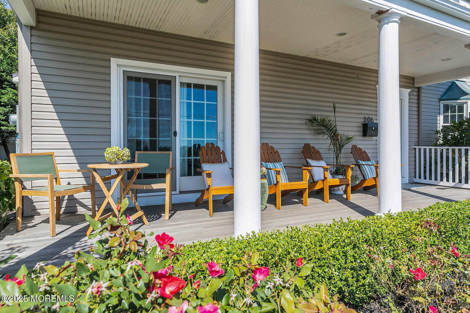 306 Ocean Road Spring Lake, NJ 07762 - Photo 4 of 58 a view of a patio with table and chairs and wooden floor