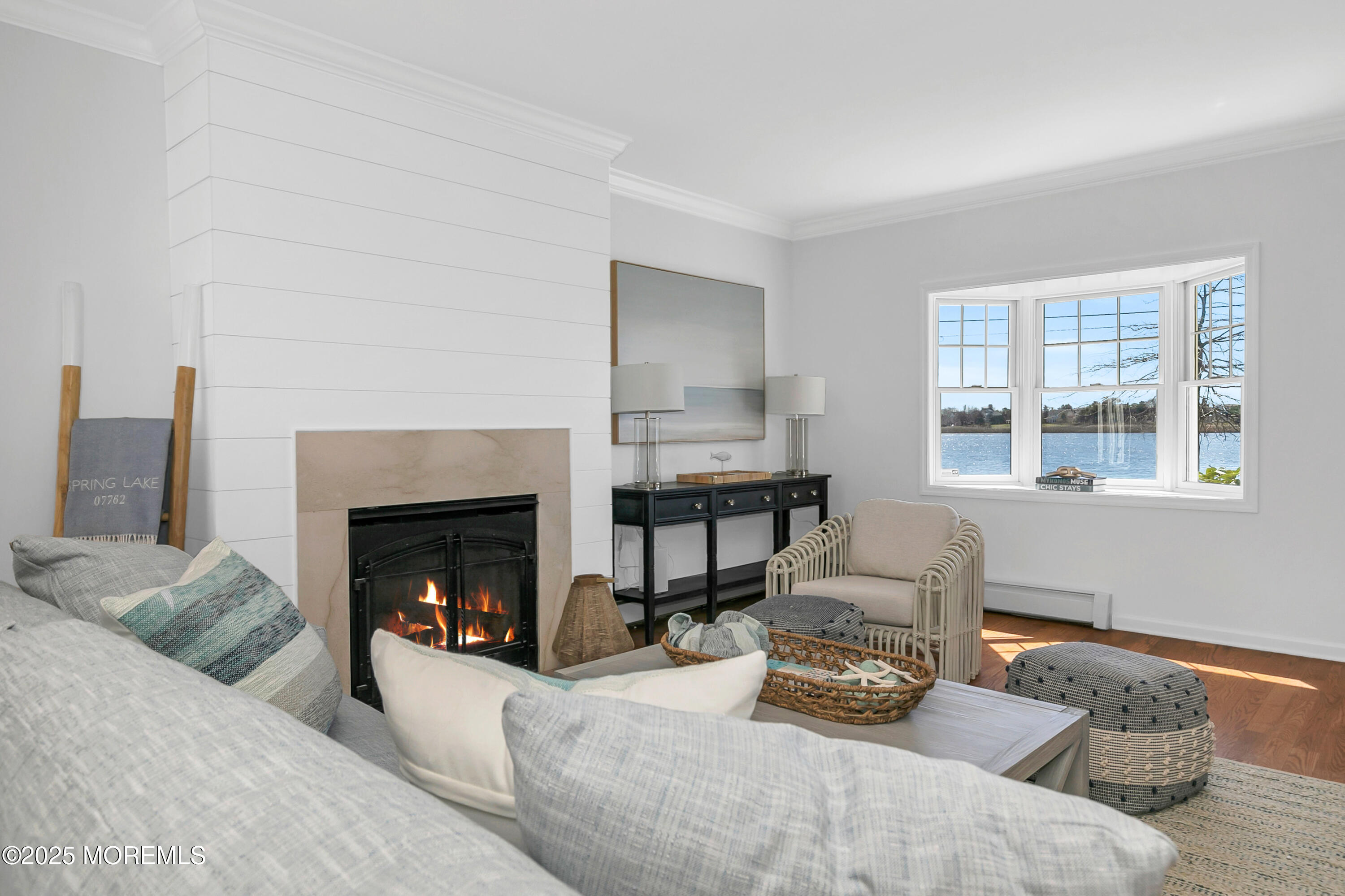 306 Ocean Road Spring Lake, NJ 07762 - Photo 8 of 58 a living room with furniture and a fireplace