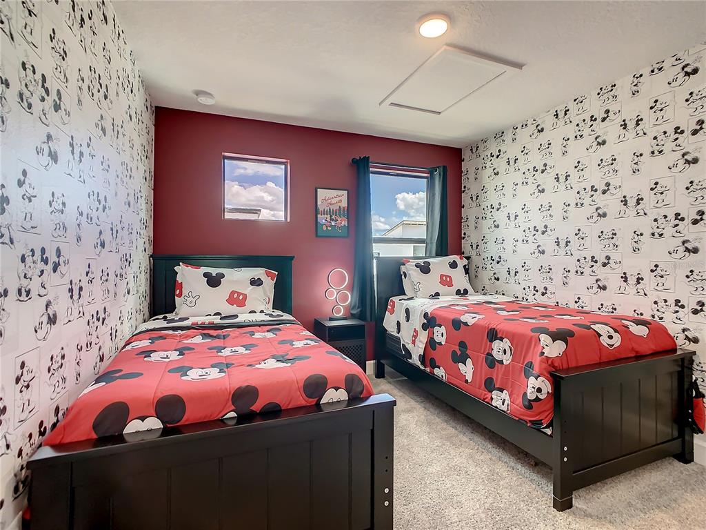 208 Villa Domani Circle Davenport, FL 33896 - Photo 11 of 26 a bedroom with a bed and a window