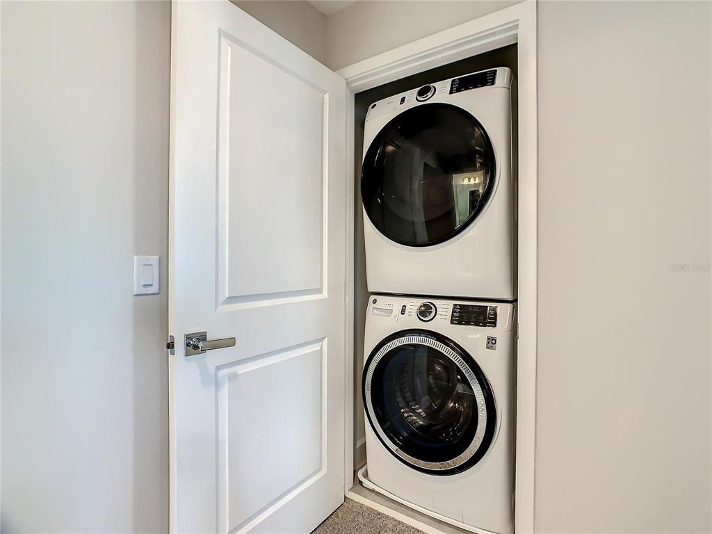 208 Villa Domani Circle Davenport, FL 33896 - Photo 21 of 26 a utility room with dryer and washer