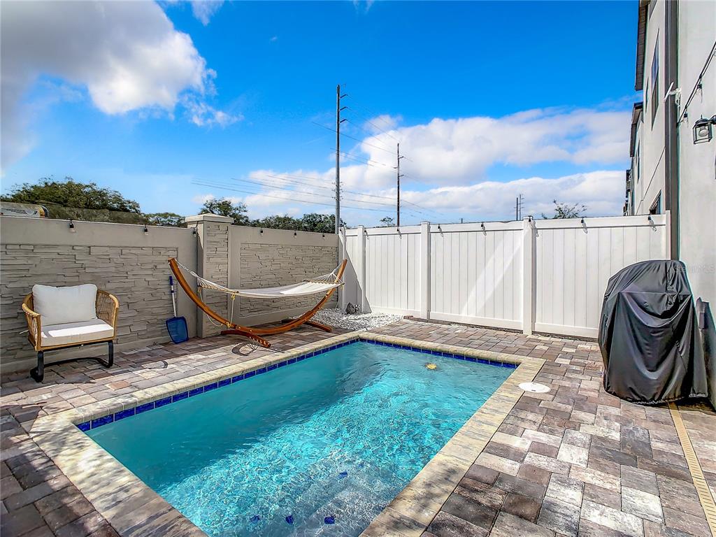 208 Villa Domani Circle Davenport, FL 33896 - Photo 22 of 26 a view of a ocean with a lounge chair