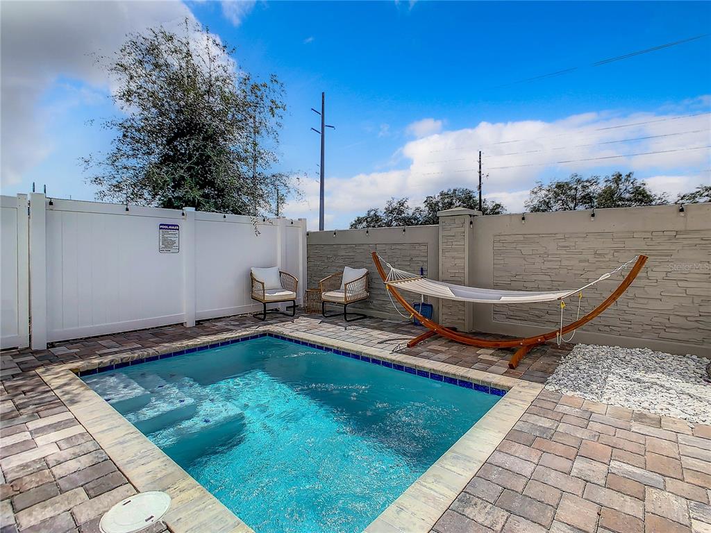 208 Villa Domani Circle Davenport, FL 33896 - Photo 23 of 26 a view of a backyard with sitting area