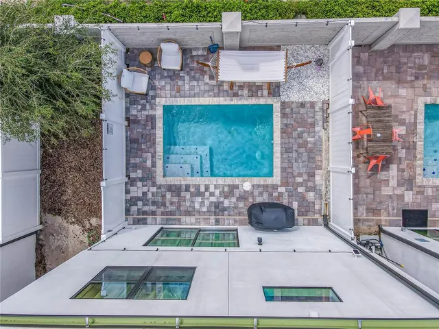an aerial view of a house with a garden