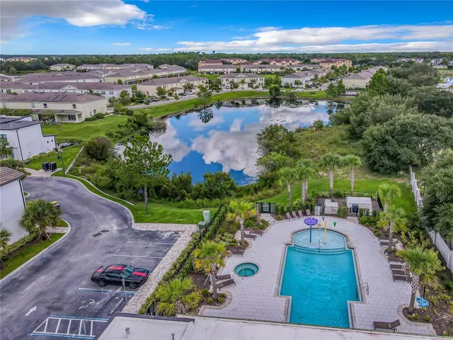 an aerial view of a house with a yard