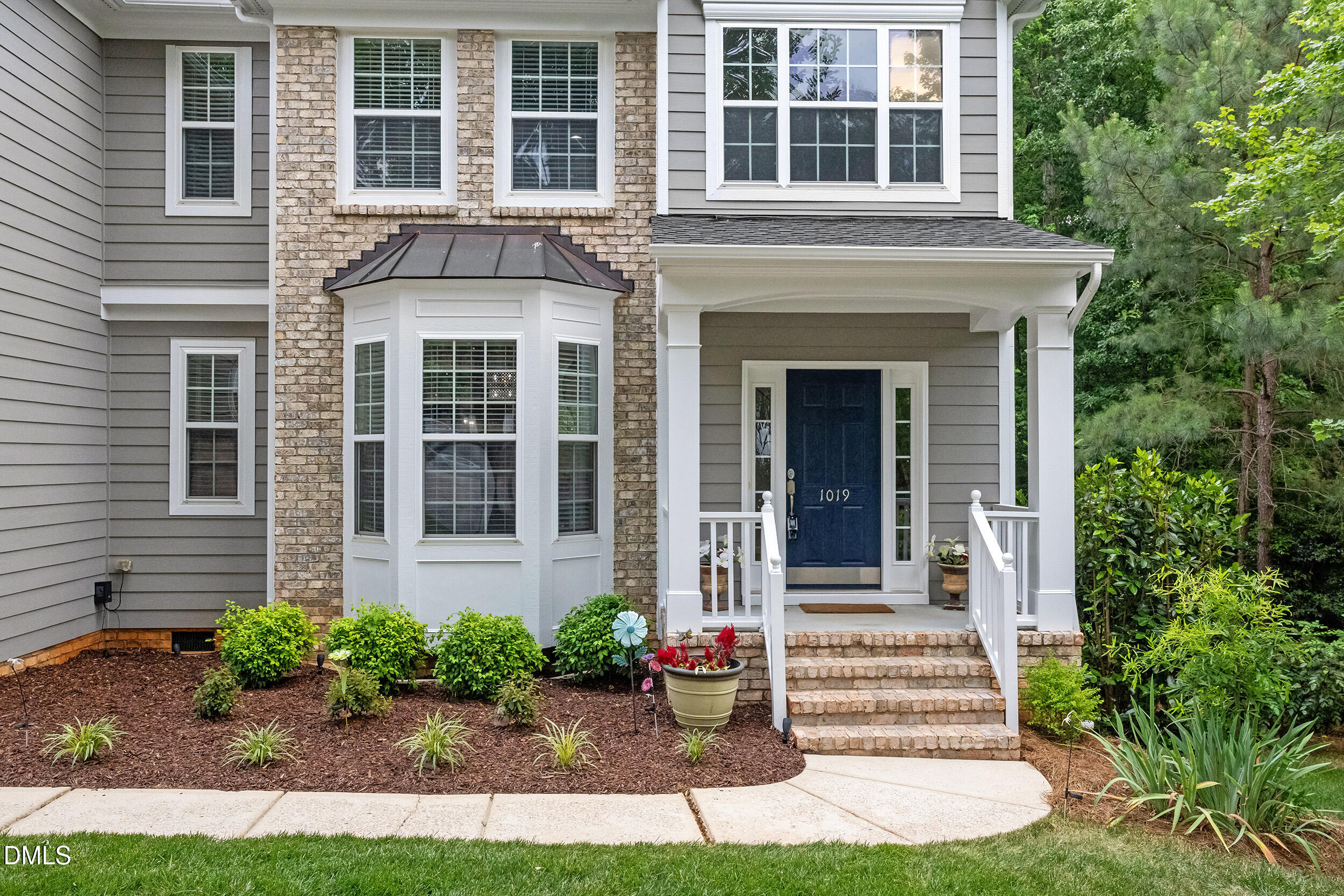 1019 Bianco Drive Raleigh, NC 27607 - Photo 3 of 29 a front view of a house with garden