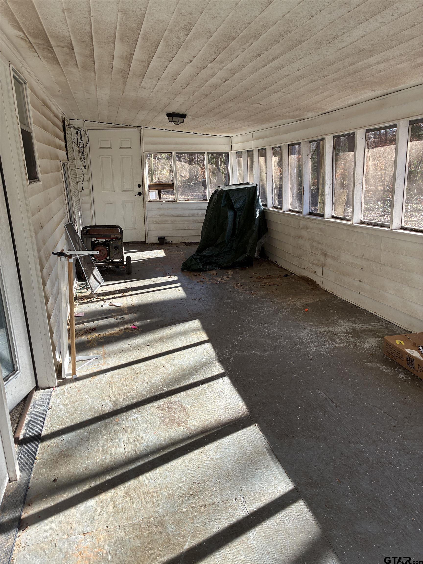 20519 Highway 69 Rusk, TX 75785 - Photo 2 of 20 a living room with furniture and a floor to ceiling window