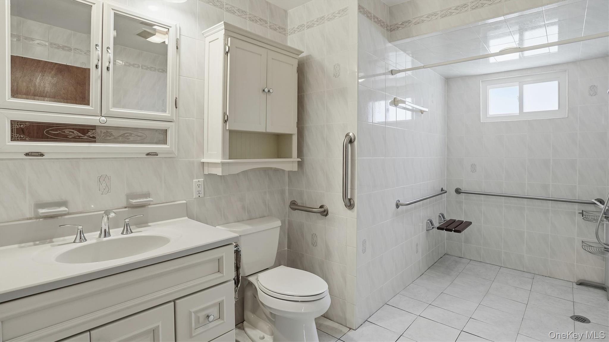 47 Vincent Road Hicksville, NY 11801 - Photo 12 of 21 a bathroom with a sink toilet and shower