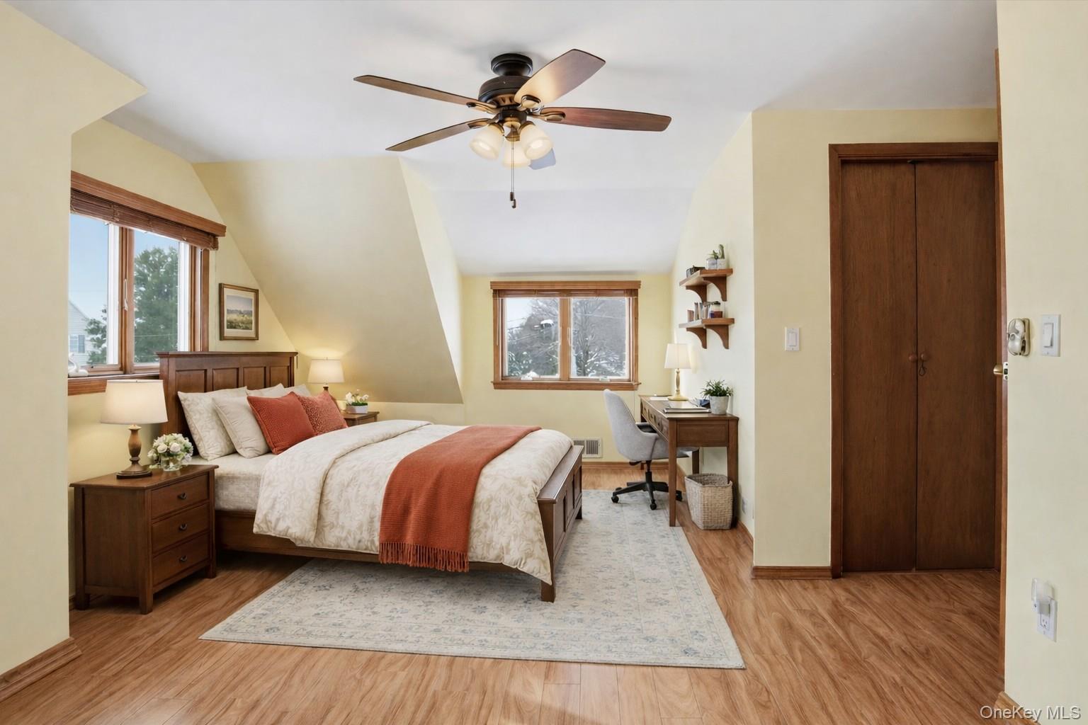 47 Vincent Road Hicksville, NY 11801 - Photo 14 of 21 a bedroom with a bed and a chandelier