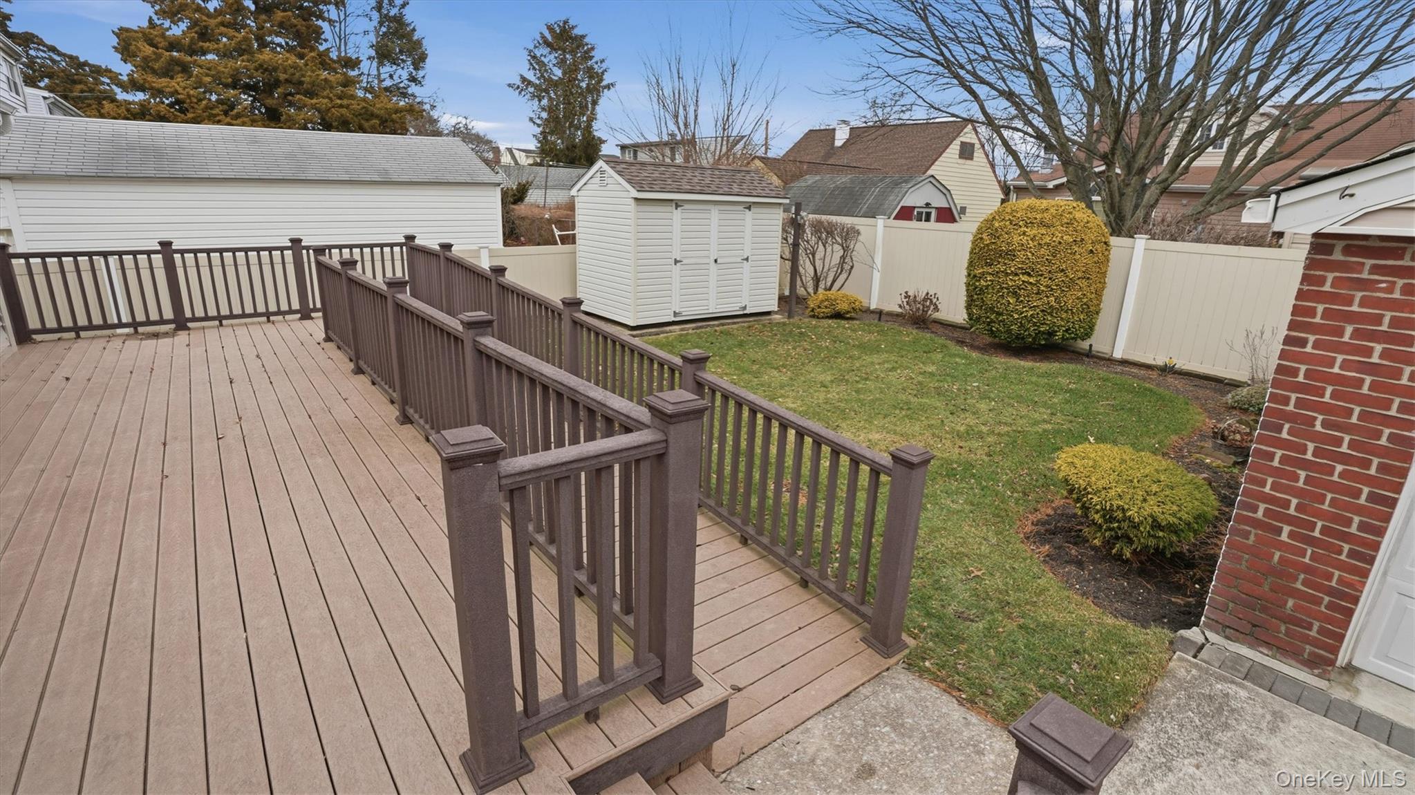 47 Vincent Road Hicksville, NY 11801 - Photo 19 of 21 a view of a house with wooden fence