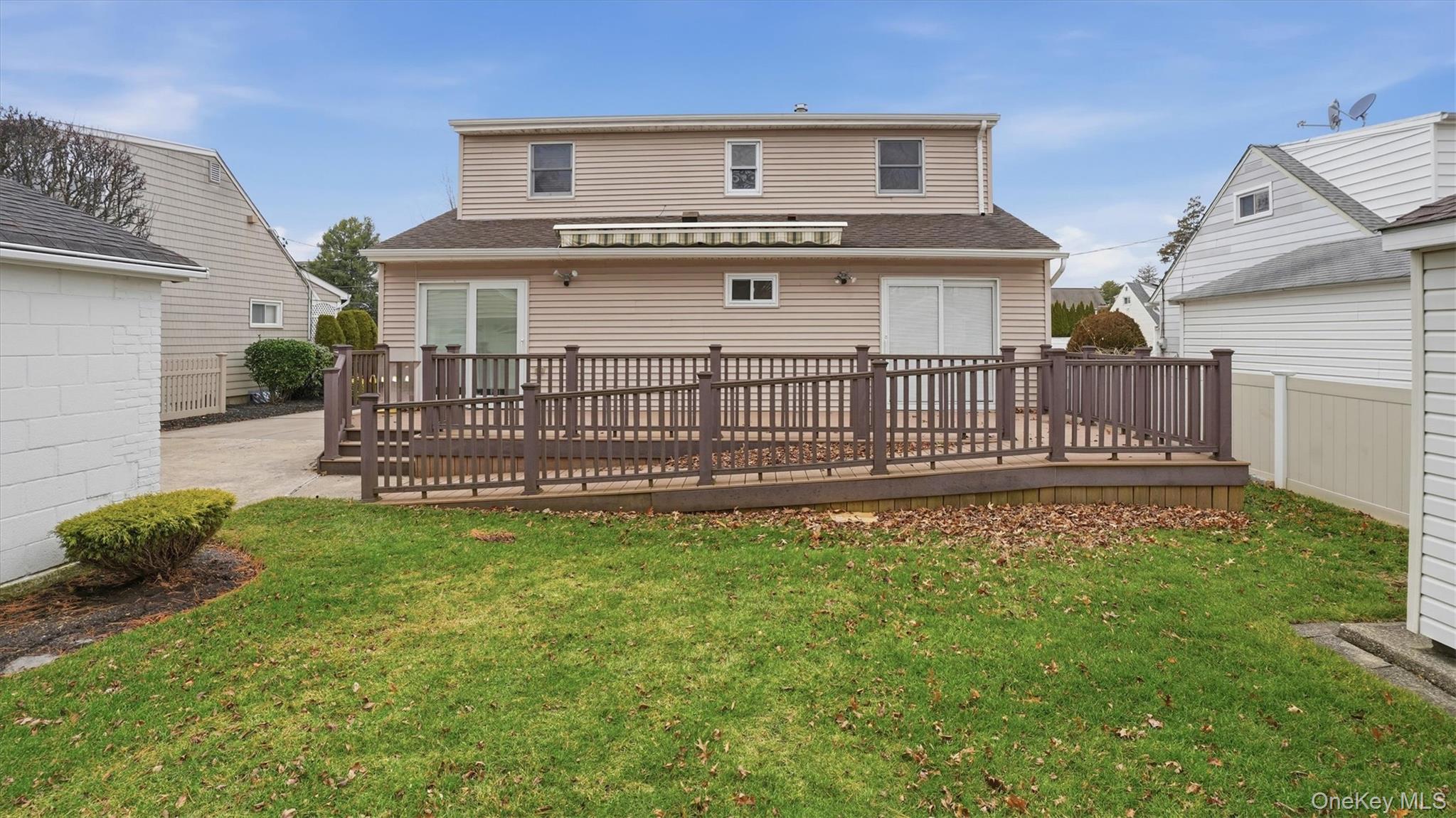 47 Vincent Road Hicksville, NY 11801 - Photo 20 of 21 a view of a house with a yard and a garden