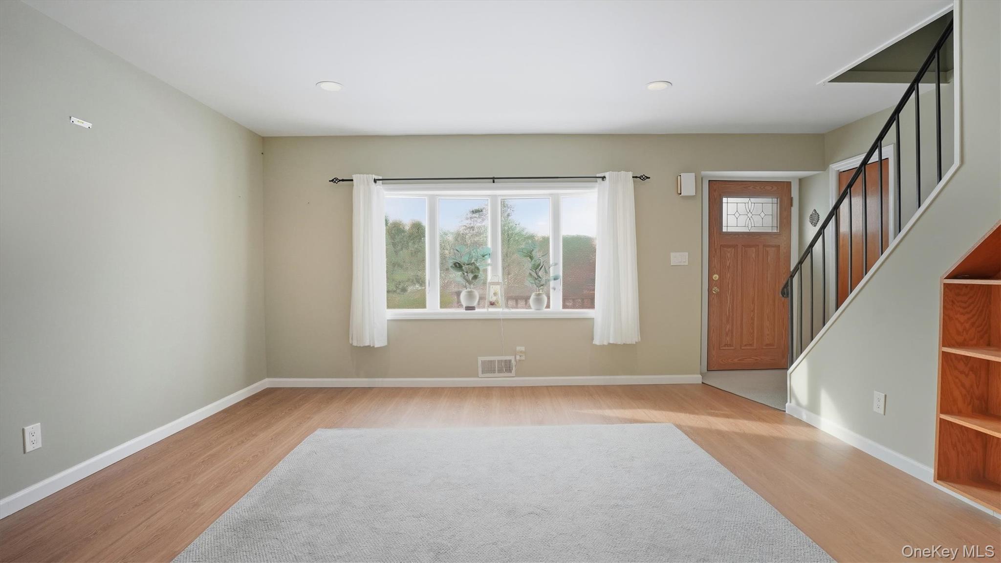 47 Vincent Road Hicksville, NY 11801 - Photo 3 of 21 a view of room with window and a ceiling fan