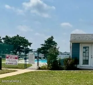 a sign board with a yard