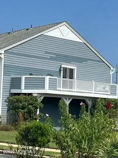 a balcony with a table and chairs