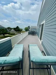 a view of a balcony with furniture