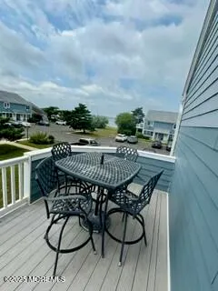 a terrace with outdoor seating and city view