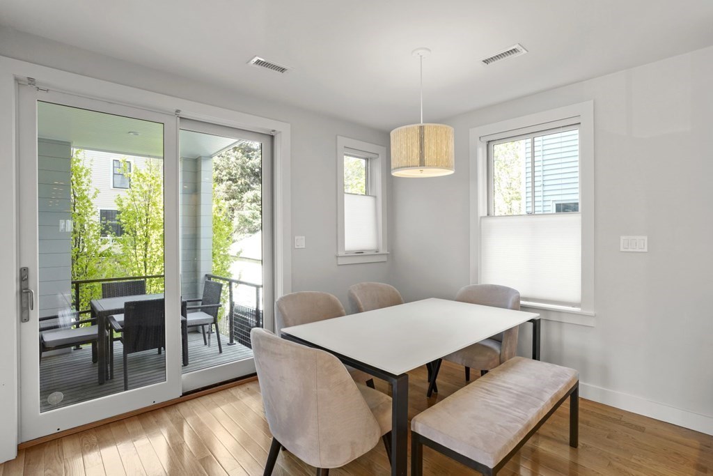 14 Hardwick Street, Unit 1 Cambridge, MA 02141 - Photo 12 of 31 a view of a dining room with furniture and wooden floor