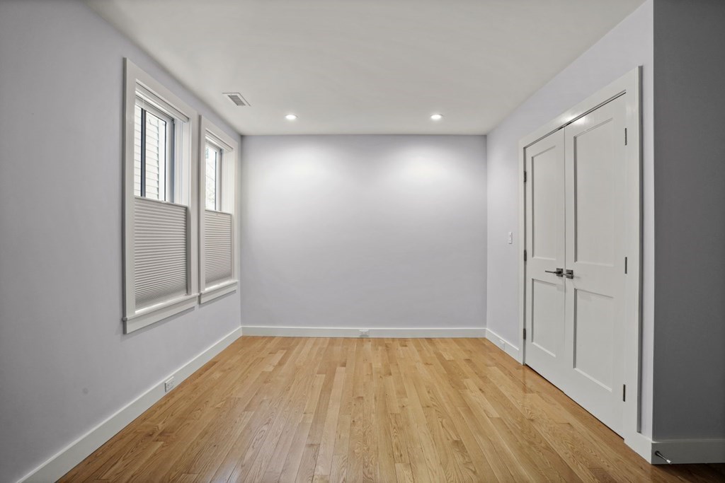 14 Hardwick Street, Unit 1 Cambridge, MA 02141 - Photo 14 of 31 a view of empty room with wooden floor and fan